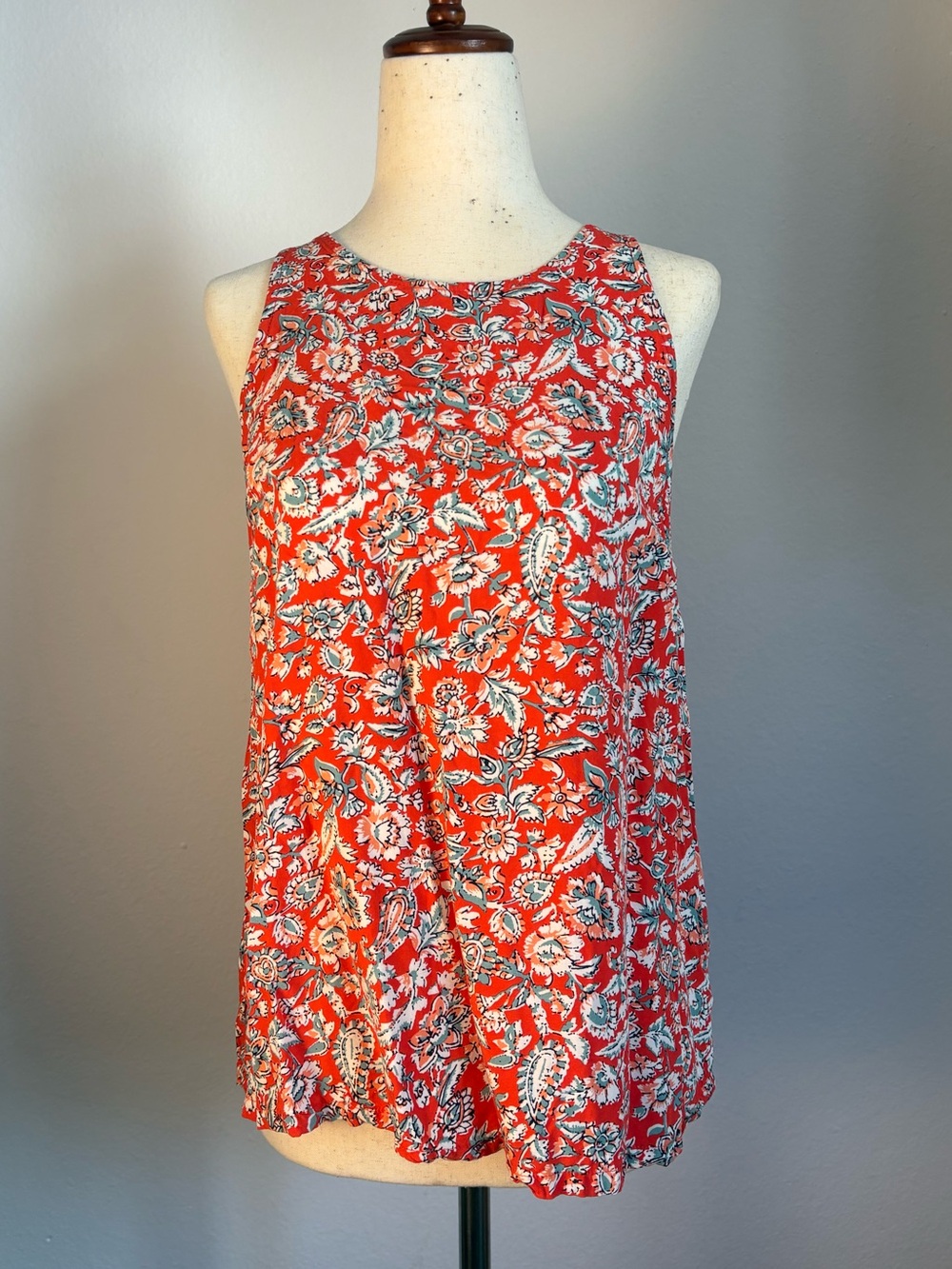 Red floral sleeveless blouse